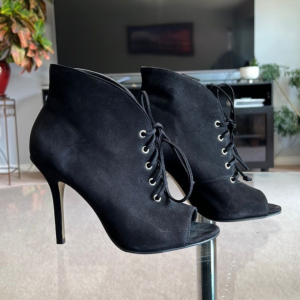 Open toe ankle boots in black suede, laces and silver details by Aldo